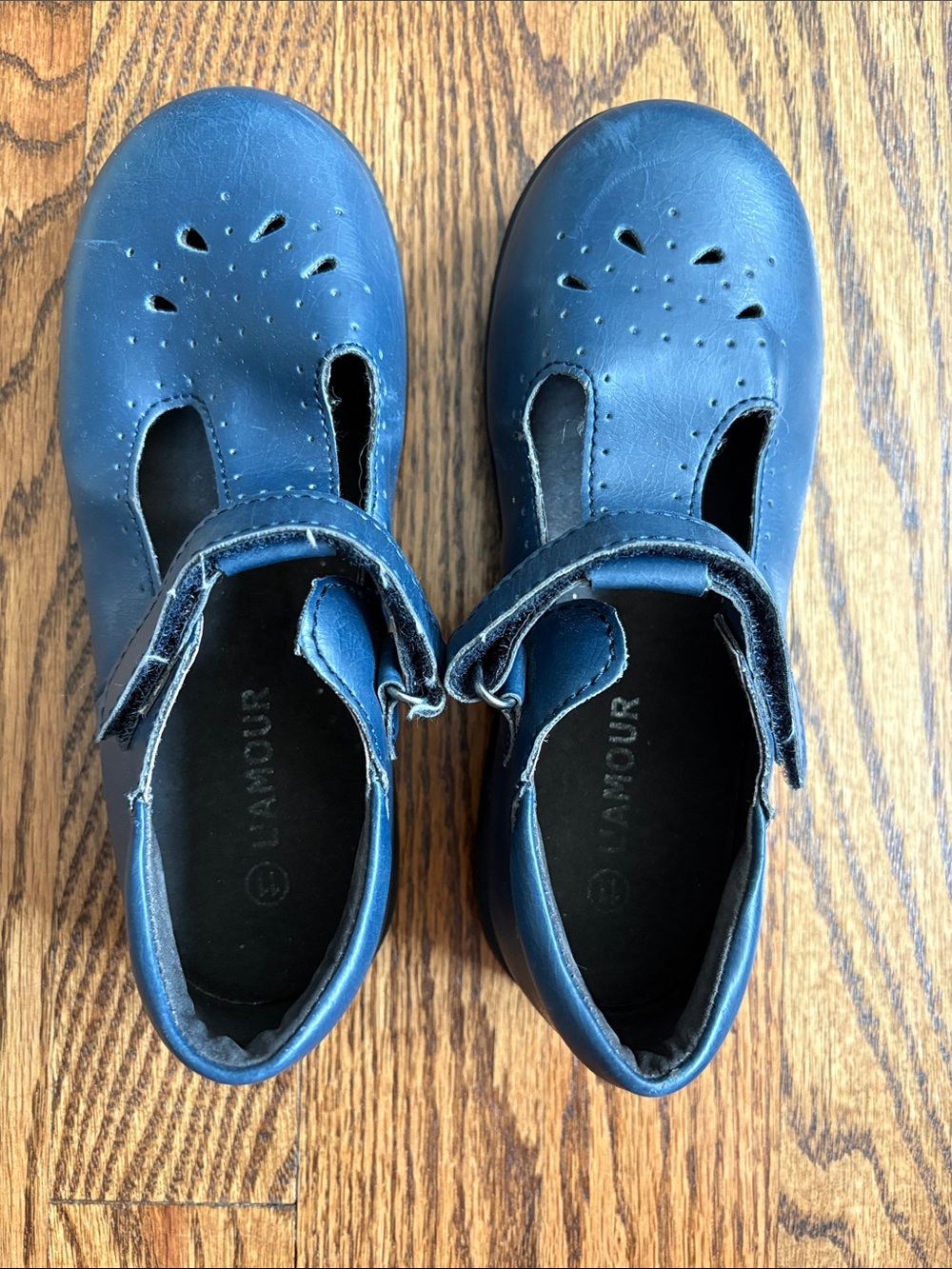 L'Amour girls navy blue with cutout pattern t-strap Mary Jane shoes, size 11.